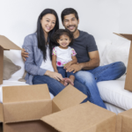 New Beginnings Program - Asian family surrounded by boxes
